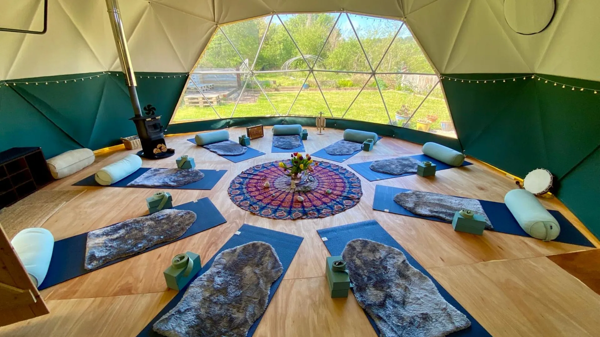 retreat-domes-header Interior of a trudomes retreat dome with yoga mats placed on floor