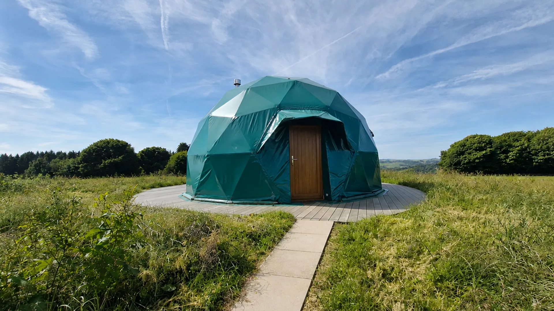 glamping dome in field with decking